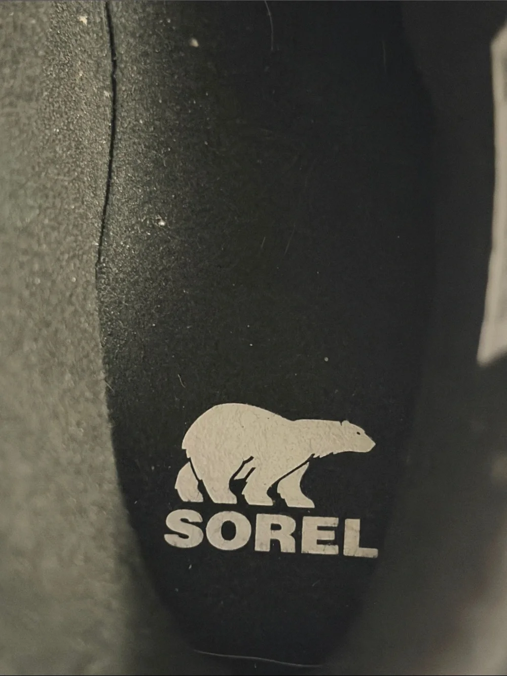 The image shows a pair of black SOREL Women's Explorer III Slip-On waterproof